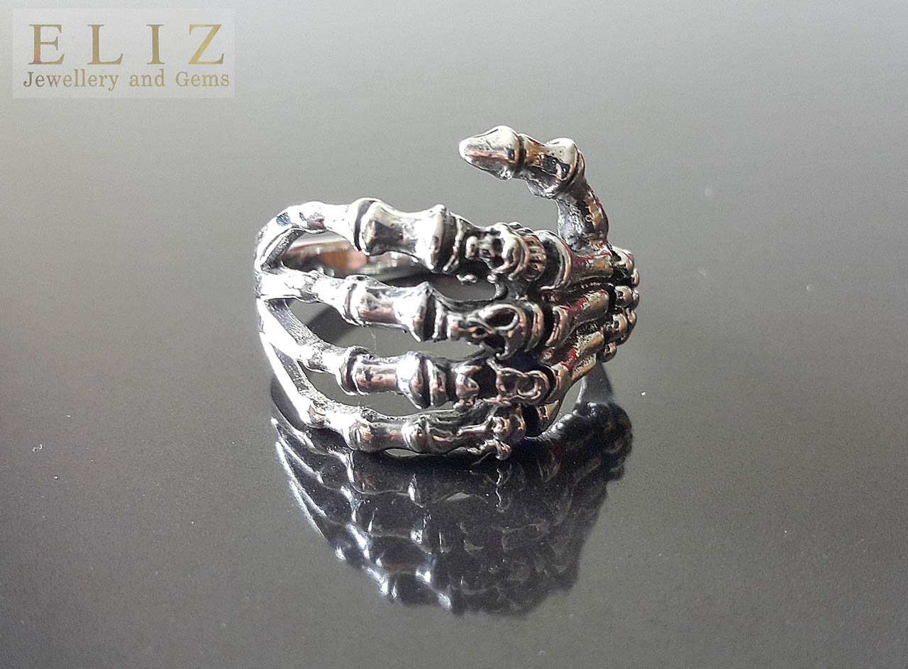 Highly detailed and massive sterling silver skeleton hand ring with brass  elements | evilrings