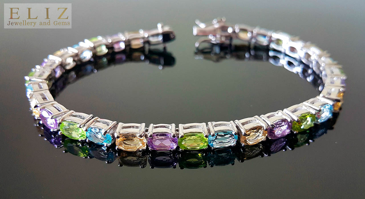 Swarovski Crystal and Zirconia Rhodium-Plated Blue Matrix Tennis Bracelet |  REEDS Jewelers